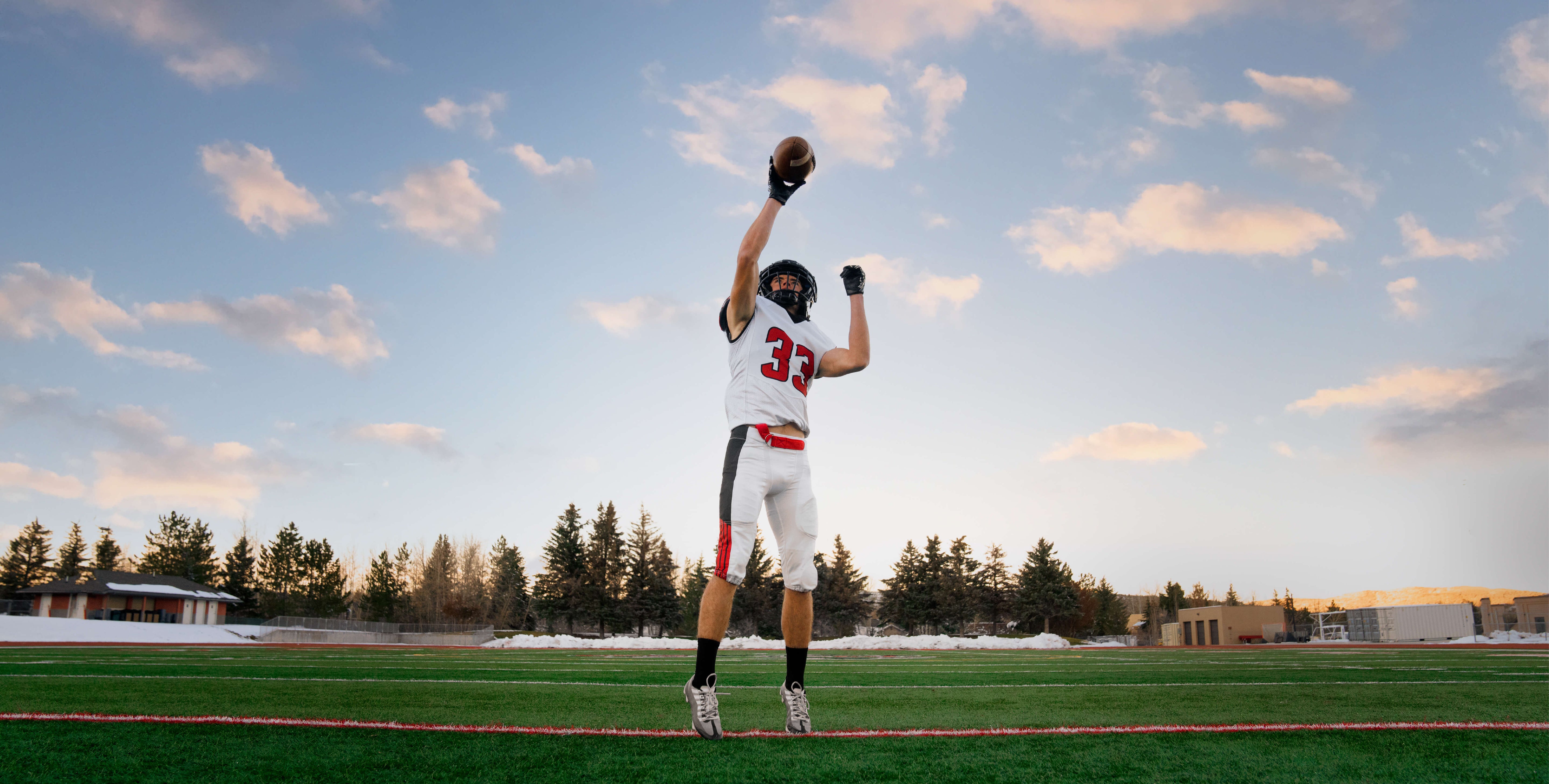 Football player sprinting with Freelap Canada wireless timing system – precision speed training and performance tracking for football athletes.