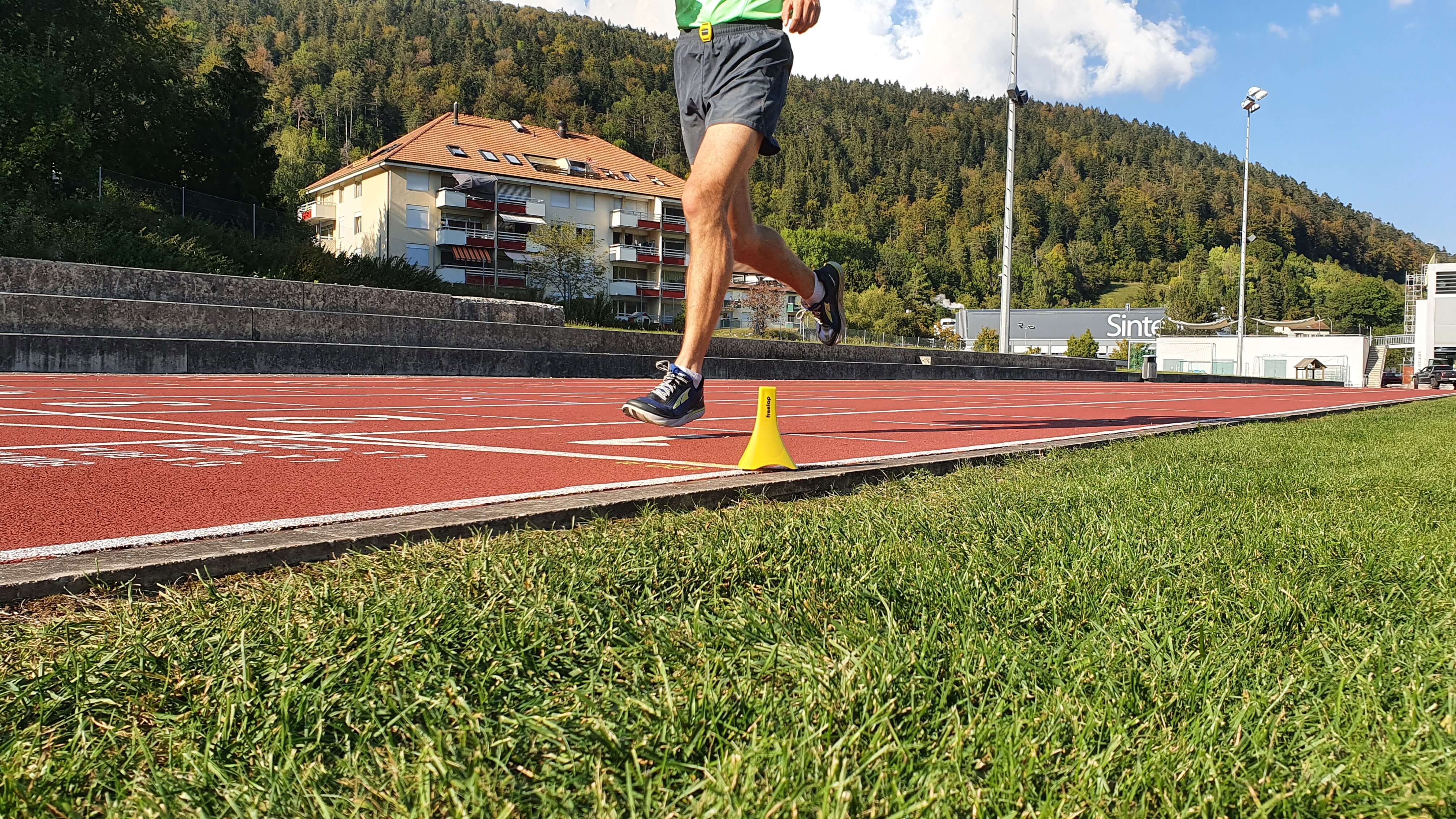 Runner crosses finish line using Freelap Canada wireless timing system during outdoor training session
